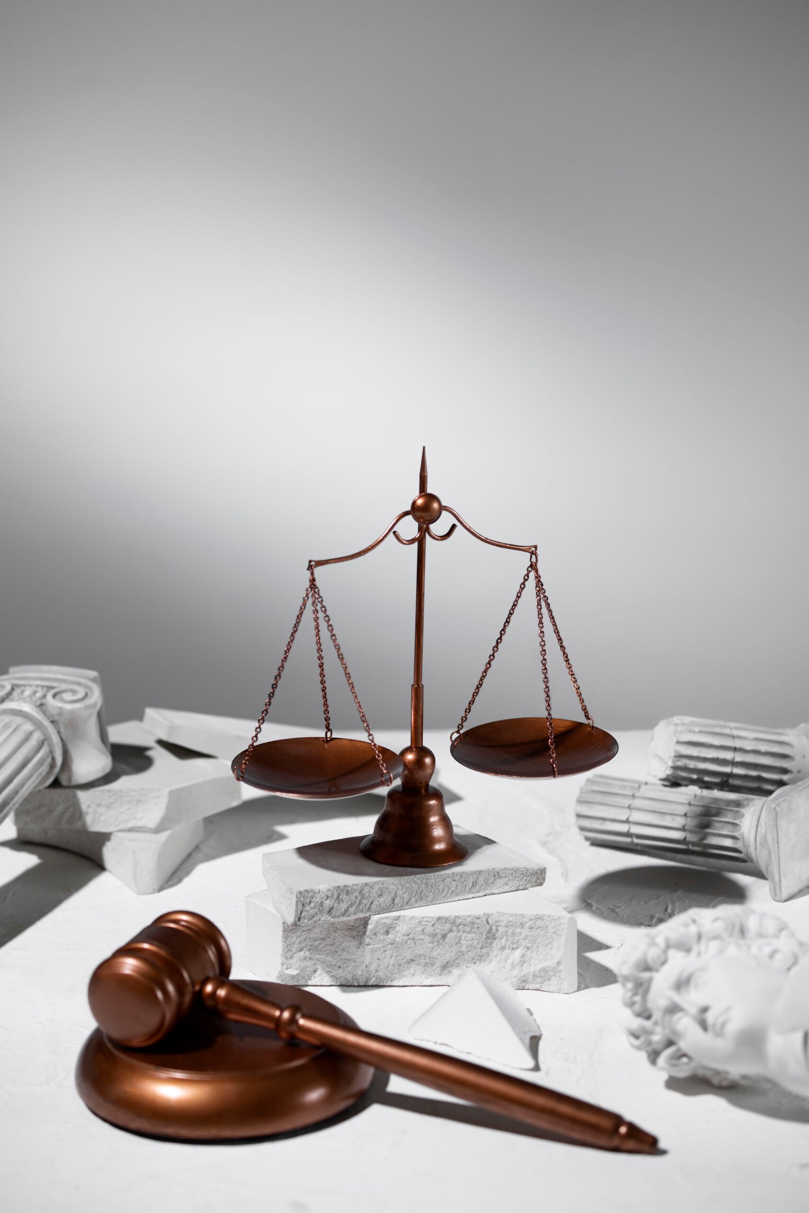 still life with scales justice scaled ARENAYA FIRM LAW DUBAI